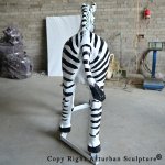 7 Back view of fiberglass zebra statue on stand
