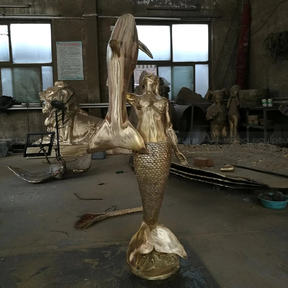 Bronze Large Mermaid Sculpture with leaping dolphin workshop