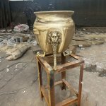 Bronze garden urns with lion head supports