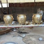 Bronze garden urns with three decorative legs