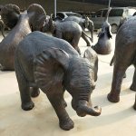 Bronze Baby Elephant Statue playing trunk