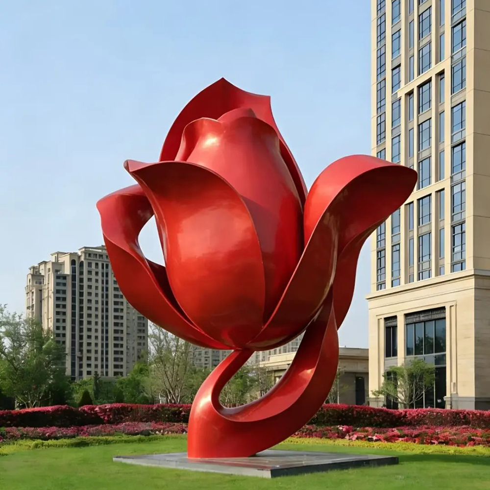 Large stainless steel red rose sculpture outdoors