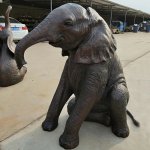 Seated Baby Elephant Statue with Curved Bronze Trunk