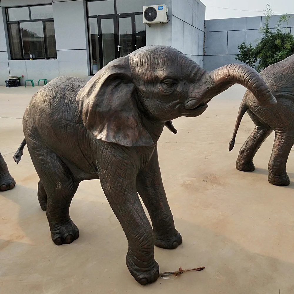 Walking Bronze Baby Elephant Statue with Raised Trunk